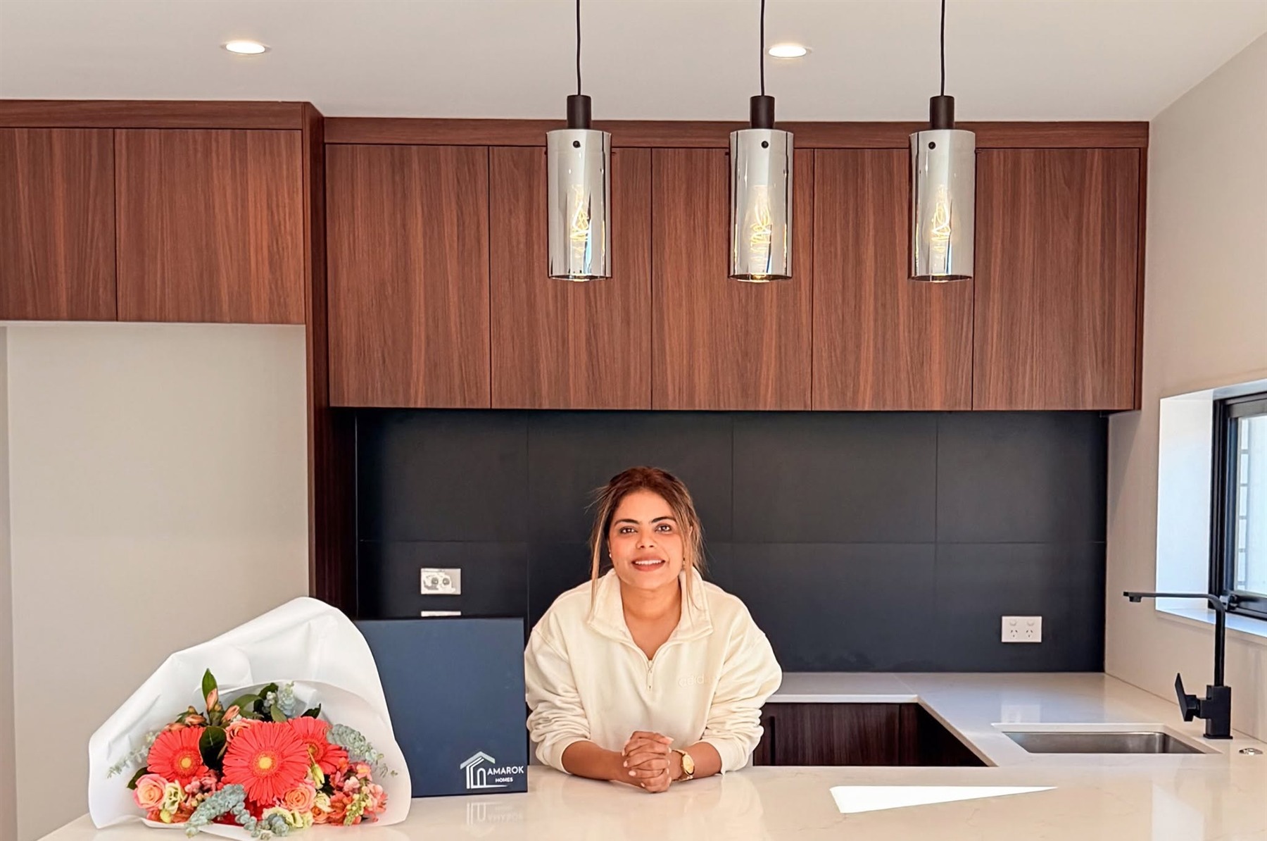 Ritu from Amarok Homes at a completed kitchen handover